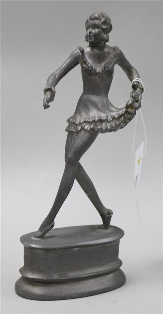 An Art Deco pewter alloy figure of a lady